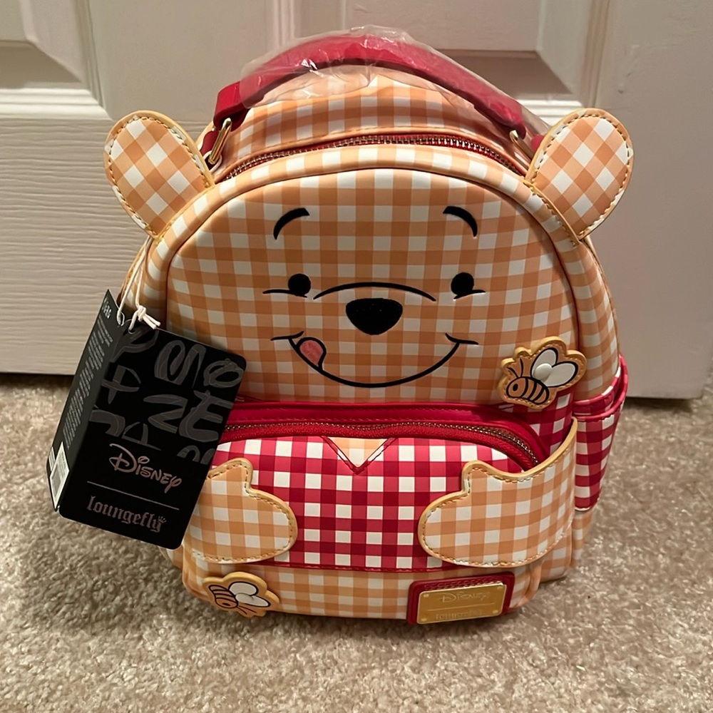 Winnie the Pooh small Loungefly backpack.